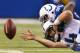 INDIANAPOLIS, IN - DECEMBER 01: Ryan Fitzpatrick #4 of the Tennessee Titans reaches for a fumble while being tackled by Josh Chapman #96 of the Indianapolis Colts during the third quarter at Lucas Oil Stadium on December 1, 2013 in Indianapolis, Indiana. (Photo by Gregory Shamus/Getty Images)