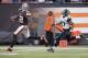 CLEVELAND, OH - DECEMBER 1: Wide receiver Josh Gordon #12 of the Cleveland Browns looks over his shoulder at cornerback Dwayne Gratz #27 of the Jacksonville Jaguars before Gordon scores a touchdown during the second half at FirstEnergy Stadium on December 1, 2013 in Cleveland, Ohio. The Jaguars defeated the Browns 32-28. (Photo by Jason Miller/Getty Images)