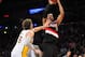 December 1, 2013; Los Angeles, CA, USA; Portland Trail Blazers power forward LaMarcus Aldridge (12) shoots a basket against the defense of Los Angeles Lakers center Pau Gasol (16) during the first half at Staples Center. Mandatory Credit: Gary A. Vasquez-USA TODAY Sports