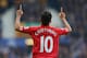 LIVERPOOL, ENGLAND - NOVEMBER 23: Coutinho of Liverpool celebrates scoring the opening goal during the Barclays Premier League match between Everton and Liverpool at Goodison Park on November 23, 2013 in Liverpool, England. (Photo by Alex Livesey/Getty Images)