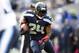 Oct 13, 2013; Seattle, WA, USA; Seattle Seahawks running back Marshawn Lynch (24) rushes against the Tennessee Titans during the fourth quarter at CenturyLink Field. Mandatory Credit: Joe Nicholson-USA TODAY Sports