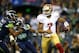 SEATTLE - SEPTEMBER 15: Colin Kaepernick #7 of the San Francisco 49ers escapes the tackle of Michael Bennett #72 of the Seattle Seahawks on September 15, 2013 at Century Link Field in Seattle, Washington. (Photo by Jonathan Ferrey/Getty Images)