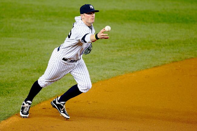 Hi-res-181821547-brendan-ryan-of-the-new-york-yankees-bobbles-the-ball_crop_north