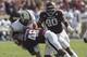 COLLEGE STATION, TX - OCTOBER 26: Darian Claiborne #48 of the Texas A&M Aggies lays a hard hit on Patton Robinette #4 of the Vanderbilt Commodores at Kyle Field on October 26, 2013 in College Station, Texas. (Photo by Bob Levey/Getty Images)