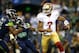 SEATTLE - SEPTEMBER 15: Colin Kaepernick #7 of the San Francisco 49ers escapes the tackle of Michael Bennett #72 of the Seattle Seahawks on September 15, 2013 at Century Link Field in Seattle, Washington. (Photo by Jonathan Ferrey/Getty Images)