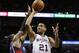 Dec 2, 2013; San Antonio, TX, USA; San Antonio Spurs forward Tim Duncan (21) drives to the basket as Atlanta Hawks forward Paul Millsap (left) defends during the first half at AT&T Center. Mandatory Credit: Soobum Im-USA TODAY Sports