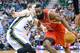 Dec 2, 2013; Salt Lake City, UT, USA; Houston Rockets shooting guard James Harden (13) dribbles around Utah Jazz shooting guard Gordon Hayward (20) during the first half at EnergySolutions Arena. Mandatory Credit: Russ Isabella-USA TODAY Sports