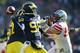 Nov 30, 2013; Ann Arbor, MI, USA; Michigan Wolverines quarterback Devin Gardner (98) throws a pass during the third quarter against the Ohio State Buckeyes at Michigan Stadium. Mandatory Credit: Andrew Weber-USA TODAY Sports