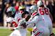 ANN ARBOR, MI - NOVEMBER 30: Quarterback Braxton Miller #5 hands the ball off to running back Carlos Hyde #34 of the Ohio State Buckeyes against the Michigan Wolverines during a game at Michigan Stadium on November 30, 2013 in Ann Arbor, Michigan. (Photo by Gregory Shamus/Getty Images)