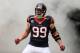 HOUSTON, TX - DECEMBER 01: J.J. Watt #99 of Houston Texans enters the field before the game against the New England Patriots at Reliant Stadium on December 1, 2013 in Houston, Texas. (Photo by Scott Halleran/Getty Images)