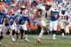 GAINESVILLE, FL - NOVEMBER 30: Kelvin Benjamin #1 of the Florida State Seminoles runs for yardage during the game against the Florida Gators on November 30, 2013 in Gainesville, Florida. (Photo by Sam Greenwood/Getty Images)