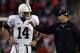 Nov 30, 2013; Madison, WI, USA; Penn State Nittany Lions head coach Bill O'Brien talks to quarterback Christian Hackenberg (14) during the game with the Wisconsin Badgers at Camp Randall Stadium. Penn State defeated Wisconsin 31-24. Mandatory Credit: Mary Langenfeld-USA TODAY Sports