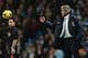 MANCHESTER, ENGLAND - DECEMBER 01: Manuel Pellegrini, manager of Manchester City throws the ball back during the Barclays Premier League match between Manchester City and Swansea City at Etihad Stadium on December 1, 2013 in Manchester, England. (Photo by Clive Brunskill/Getty Images)