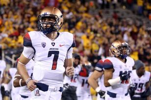Hi-res-452674189-quarterback-b-j-denker-of-the-arizona-wildcats-runs-out_crop_north