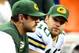 Nov 28, 2013; Detroit, MI, USA; Green Bay Packers quarterback Aaron Rodgers (left) sits on the bench next to quarterback Matt Flynn (10) during the fourth quarter of a NFL football game against the Detroit Lions on Thanksgiving at Ford Field. Mandatory Credit: Andrew Weber-USA TODAY Sports