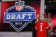 NEW YORK, NY - APRIL 25: Eric Reid (C) of the LSU Tigers holds his daughter Leilani as they stand with NFL Commissioner Roger Goodell as they hold up a jersey on stage after Reid was picked #18 overall by the San Francisco 49ers in the first round of the 2013 NFL Draft at Radio City Music Hall on April 25, 2013 in New York City. (Photo by Al Bello/Getty Images)