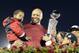 Jan 1, 2013; Pasadena, CA, USA; Stanford Cardinal head coach David Shaw shows off the Rose Bowl trophy to his three sons after the 2013 Rose Bowl game against the Wisconsin Badgers at the Rose Bowl. Stanford won 20-14. Mandatory Credit: Richard Mackson-USA TODAY Sports
