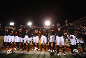 Hi-res-451649999-the-oklahoma-state-cowboys-celebrate-a-49-17-win_crop_north