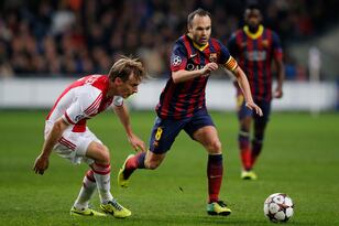 Hi-res-452212289-christian-poulsen-of-ajax-and-andres-iniesta-of_crop_north