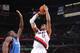 PORTLAND, OR - DECEMBER 4: LaMarcus Aldridge #12 of the Portland Trailblazers puts up the shot against the Oklahoma City Thunder on December 4, 2013 at the Moda Center Arena in Portland, Oregon. NOTE TO USER: User expressly acknowledges and agrees that, by downloading and or using this photograph, user is consenting to the terms and conditions of the Getty Images License Agreement. Mandatory Copyright Notice: Copyright 2013 NBAE (Photo by Sam Forencich/NBAE via Getty Images)
