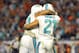 Nov 17, 2013; Miami Gardens, FL, USA; Miami Dolphins safety Jimmy Wilson (27) and Miami Dolphins cornerback Brent Grimes (21) celebrate a win over the San Diego Chargers after the second half at Sun Life Stadium. The Dolphins won the game 20-16. Mandatory Credit: Joe Camporeale-USA TODAY Sports
