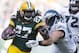 Nov 10, 2013; Green Bay, WI, USA; Green Bay Packers running back Eddie Lacy (27) runs with the ball as Philadelphia Eagles linebacker Connor Barwin (98) tackles during the third quarter at Lambeau Field. The Eagles won 27-13. Mandatory Credit: Jeff Hanisch-USA TODAY Sports