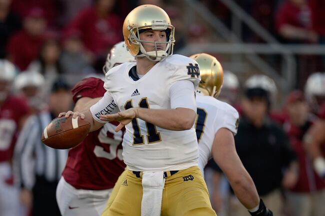 Hi-res-452665827-tommy-rees-of-the-notre-dame-fighting-irish-drops-back_crop_north