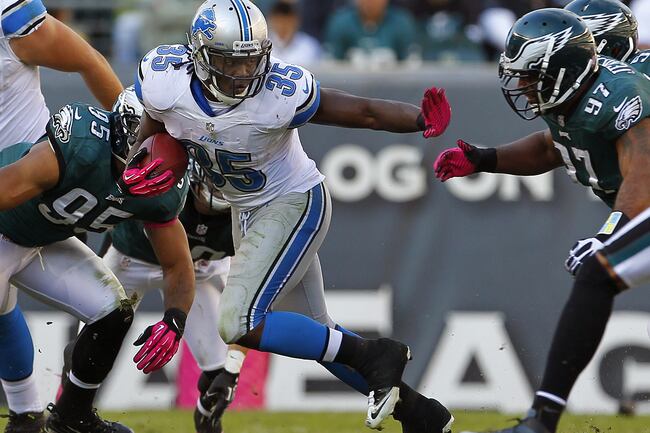 Hi-res-154122914-joique-bell-of-the-detroit-lions-looks-to-evade-mychal_crop_north