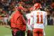 November 17, 2013; Denver, CO, USA; Kansas City Chiefs head coach Andy Reid (left) talks to quarterback Alex Smith (11) during the fourth quarter against the Denver Broncos at Sports Authority Field at Mile High. The Broncos defeated the Chiefs 27-17. Mandatory Credit: Kyle Terada-USA TODAY Sports