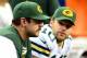 Nov 28, 2013; Detroit, MI, USA; Green Bay Packers quarterback Aaron Rodgers (left) sits on the bench next to quarterback Matt Flynn (10) during the fourth quarter of a NFL football game against the Detroit Lions on Thanksgiving at Ford Field. Mandatory Credit: Andrew Weber-USA TODAY Sports