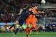 JOHANNESBURG, SOUTH AFRICA - JULY 11: Carles Puyol of Spain challenges Robin Van Persie of the Netherlands during the 2010 FIFA World Cup South Africa Final match between Netherlands and Spain at Soccer City Stadium on July 11, 2010 in Johannesburg, South Africa. (Photo by Jasper Juinen/Getty Images)