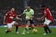 MANCHESTER, ENGLAND - DECEMBER 26: Danny Simpson of Newcastle United moves between Ryan Giggs and Patrice Evra of Manchester United during the Barclays Premier League match between Manchester United and Newcastle United at Old Trafford December 26, 2012 in Manchester, England. (Photo by Clive Brunskill/Getty Images)