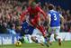 LIVERPOOL, ENGLAND - NOVEMBER 23: Glen Johnson of Liverpool hurdles the challenge of Steven Pienaar of Everton during the Barclays Premier League match between Everton and Liverpool at Goodison Park on November 23, 2013 in Liverpool, England. (Photo by Alex Livesey/Getty Images)