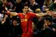 LIVERPOOL, ENGLAND - DECEMBER 4: Luis Suarez of Liverpool celebrates his first goal from a long range effort during the Barclays Premier League match between Liverpool and Norwich City at Anfield on December 4, 2013 in Liverpool, England. (Photo by Jan Kruger/Getty Images)