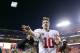 Dec 1, 2013; Landover, MD, USA; New York Giants quarterback Eli Manning (10) throws a wrist band into the stands after the Giants' game against the Washington Redskins at FedEx Field. The Giants won 24-17. Mandatory Credit: Geoff Burke-USA TODAY Sports