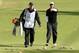 THOUSAND OAKS, CA - DECEMBER 07: Tiger Woods points as he walks to the fourth green with caddie Joe LaCava during the third round of the Northwestern Mutual World Challenge at Sherwood Country Club on December 7, 2013 in Thousand Oaks, California. (Photo by Stephen Dunn/Getty Images)