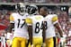 GLENDALE, AZ - OCTOBER 23: Mike Wallace #17 of the Pittsburgh Steelers celebrates his 95-yard touchdown with teammates Antonio Brown #84 and Isaac Redman #33 during the second quarter against the Arizona Cardinals at University of Phoenix Stadium on October 23, 2011 in Glendale, Arizona. (Photo by Christian Petersen/Getty Images)
