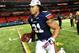 Dec 7, 2013; Atlanta, GA, USA; Auburn Tigers running back Tre Mason (21) runs with his MVP trophy after the 2013 SEC Championship game against the Missouri Tigers at Georgia Dome. The Auburn Tigers defeated the Missouri Tigers 59-42. Mandatory Credit: Kevin Liles-USA TODAY Sports