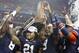 Dec 7, 2013; Atlanta, GA, USA; Auburn Tigers running back Tre Mason (21) celebrates with teammates after defeating the Missouri Tigers in the 2013 SEC Championship game at Georgia Dome. Auburn won 59-42. Mandatory Credit: Brett Davis-USA TODAY Sports