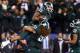 INDIANAPOLIS, IN - DECEMBER 07: Jeremy Langford #33 of the Michigan State Spartans is lifted by teammate Fou Fonoti #51 after scoring the game winning touchdown in the fourth quarterof the Big Ten Conference Championship game against the Ohio State Buckeyes at Lucas Oil Stadium on December 7, 2013 in Indianapolis, Indiana. (Photo by Andy Lyons/Getty Images)