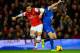 LONDON, ENGLAND - DECEMBER 08: Mesut Oezil of Arsenal and Seamus Coleman of Everton battle for the ball during the Barclays Premier League match between Arsenal and Everton at Emirates Stadium on December 8, 2013 in London, England. (Photo by Michael Regan/Getty Images)