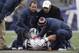 Dec 8, 2013; Foxborough, MA, USA; Medical staff attend to New England Patriots tight end Rob Gronkowski (87) after he was injured by a Cleveland Browns player during the third quarter at Gillette Stadium. Mandatory Credit: Stew Milne-USA TODAY Sports