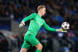 Hi-res-452288709-joe-hart-of-manchester-city-kicks-down-field-during-the_crop_north
