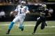 NEW ORLEANS, LA - DECEMBER 08: Quarterback Cam Newton #1 of the Carolina Panthers runs to escape the defense of Malcolm Jenkins #27 of the New Orleans Saints during the first quarter at Mercedes-Benz Superdome on December 8, 2013 in New Orleans, Louisiana. (Photo by Chris Graythen/Getty Images)