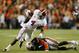 AUBURN, AL - NOVEMBER 30: T.J. Yeldon #4 of the Alabama Crimson Tide tries to avoid the tackle of Chris Davis #11 of the Auburn Tigers in the third quarter at Jordan-Hare Stadium on November 30, 2013 in Auburn, Alabama. (Photo by Kevin C. Cox/Getty Images)