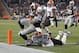Dec 8, 2013; Foxborough, MA, USA; New England Patriots wide receiver Danny Amendola (80) scores the winning touchdown as Cleveland Browns defensive back Buster Skrine (22) defends on the play during the fourth quarter at Gillette Stadium. Mandatory Credit: Stew Milne-USA TODAY Sports