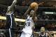 Nov 30, 2013; Memphis, TN, USA; Memphis Grizzlies guard Quincy Pondexter (20) drives between Brooklyn Nets forwards Kevin Garnett (2) and Joe Johnson (7) at FedExForum. Brooklyn defeated Memphis 97-88. Mandatory Credit: Nelson Chenault-USA TODAY Sports