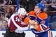 EDMONTON, AB - DECEMBER 5: Luke Gazdic #20 of the Edmonton Oilers fights Patrick Bordeleau #58 of the Colorado Avalanche during an NHL game at Rexall Place on December 5, 2013 in Edmonton, Alberta, Canada. The Oilers defeated the Avalanche 8-2. (Photo by Derek Leung/Getty Images)