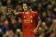 LIVERPOOL, ENGLAND - DECEMBER 07: Luis Suarez of Liverpool celebrates scoring his team's third goal during the Barclays Premier League match between Liverpool and West Ham United at Anfield on December 7, 2013 in Liverpool, England. (Photo by Clive Brunskill/Getty Images)