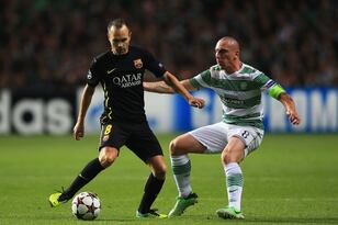 Hi-res-182601963-andres-iniesta-of-barcelona-holds-off-scott-brown-of_crop_north